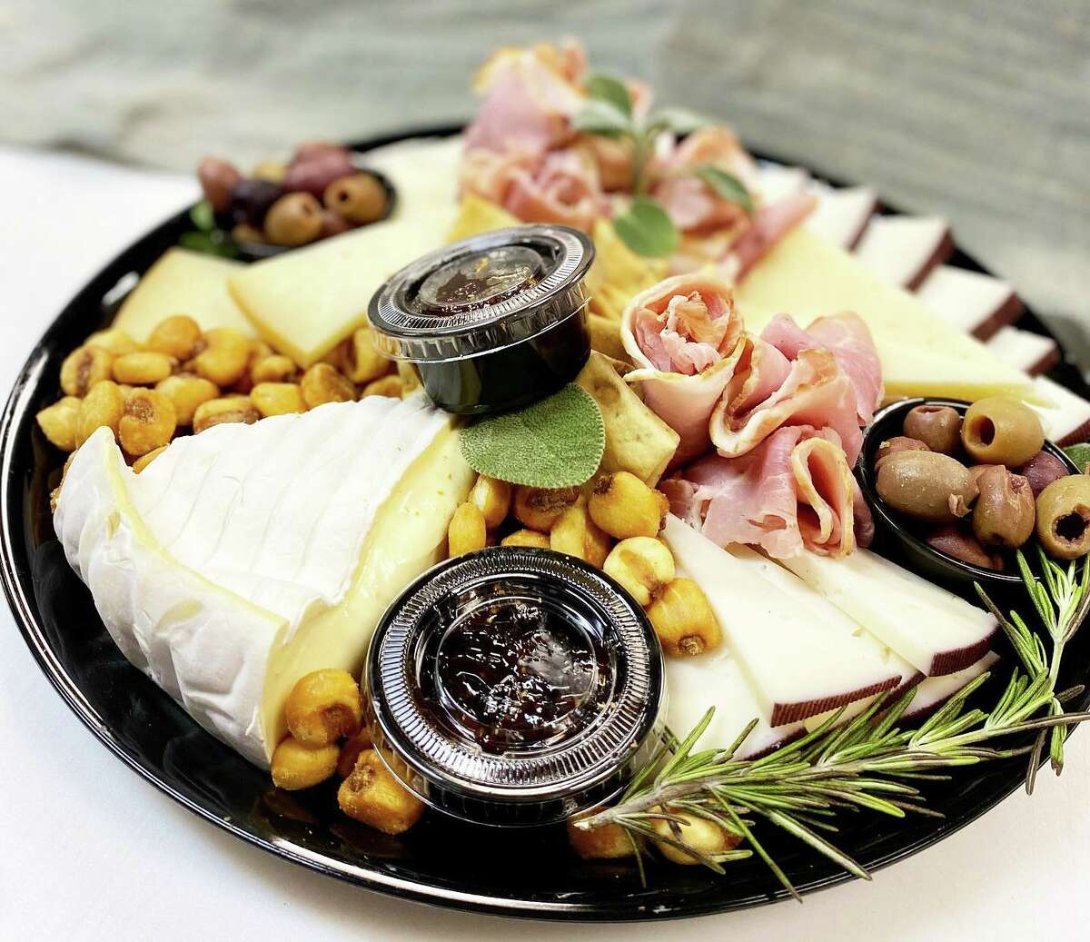 Spread Cheese Co., in Main Street Market at 386 Main St., Middletown, is offering cheese and wine platters and baskets for holiday gift-giving.