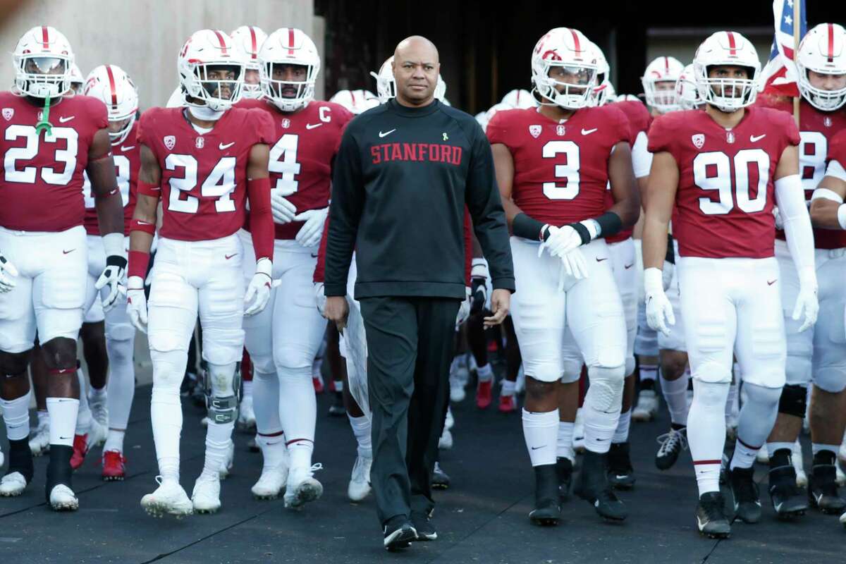 Stanford Head Coach David Shaw leads his team into the field before the annual Big Game against California in Stanford, Calif. Saturday, Nov. 20, 2021.