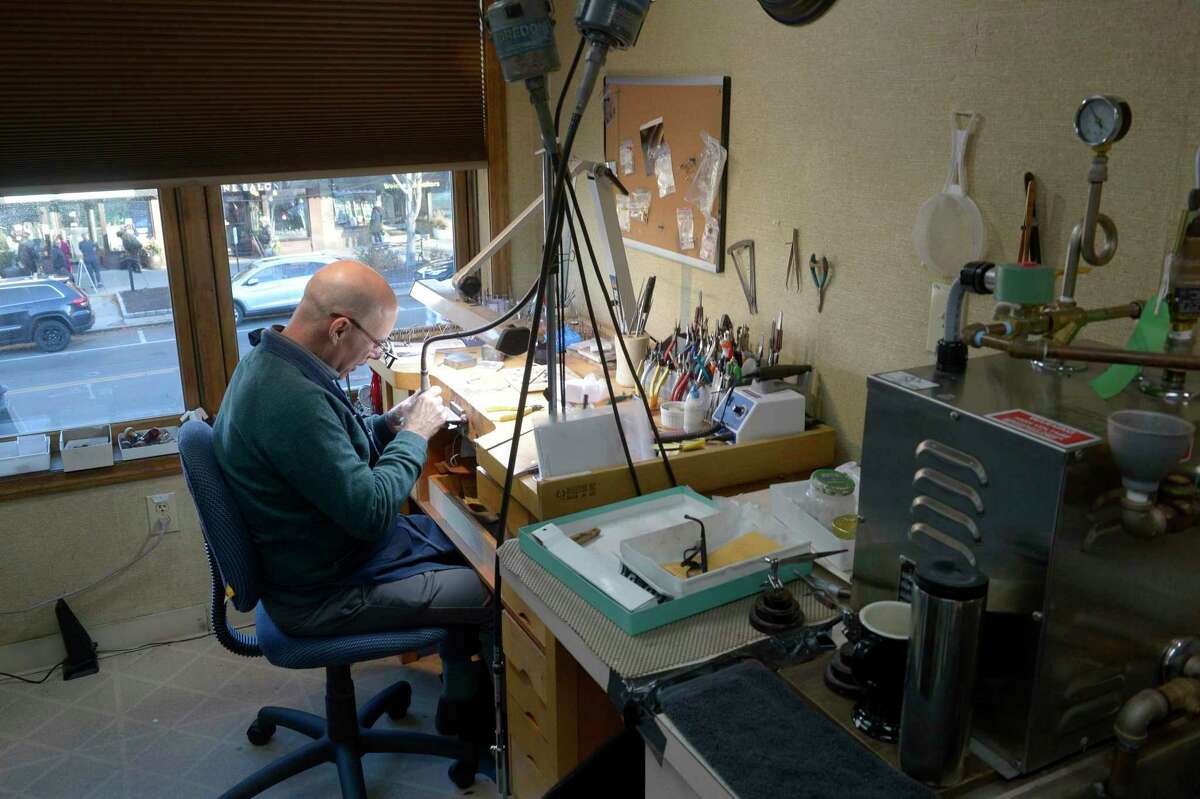 Master jeweler Fred Franklin works on an engagement ring at Addessi Jewelers in Ridgefield, Conn. Wednesday, Nov. 24, 2021.
