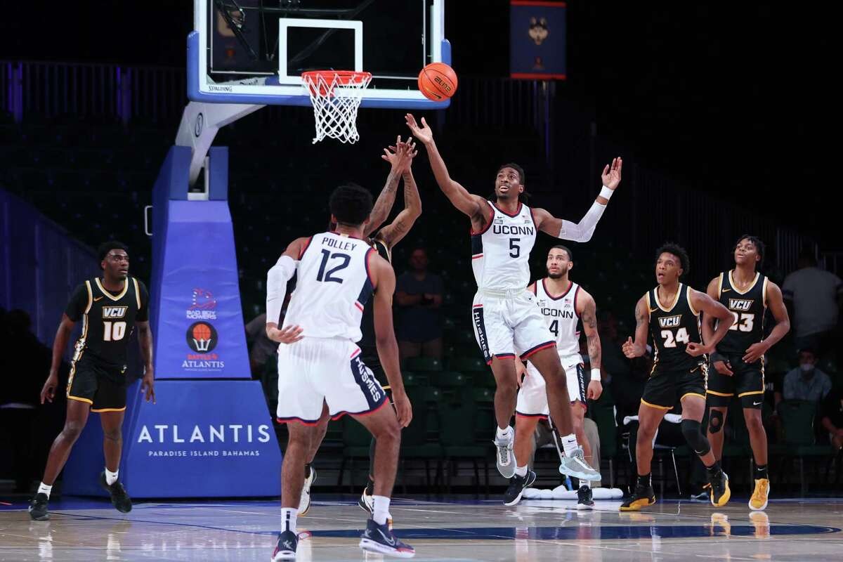 UConn’s Isaiah Whaley (5) reaches for a rebound at the Bad Boy Mower’s Battle 4 Atlantis on Friday.