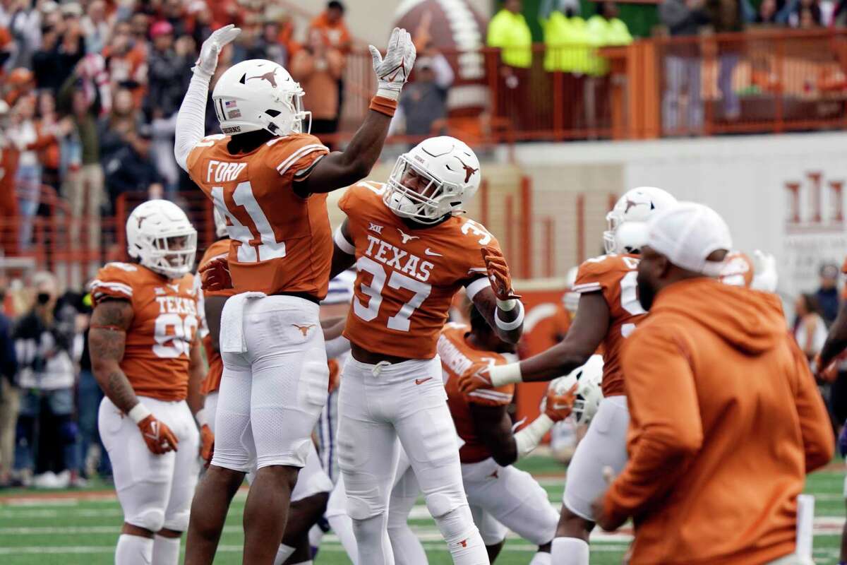 Jaylan Ford (51) will hold down the middle for the Texas linebackers but Morice Blackwell (37) is expected to play more on the outside.