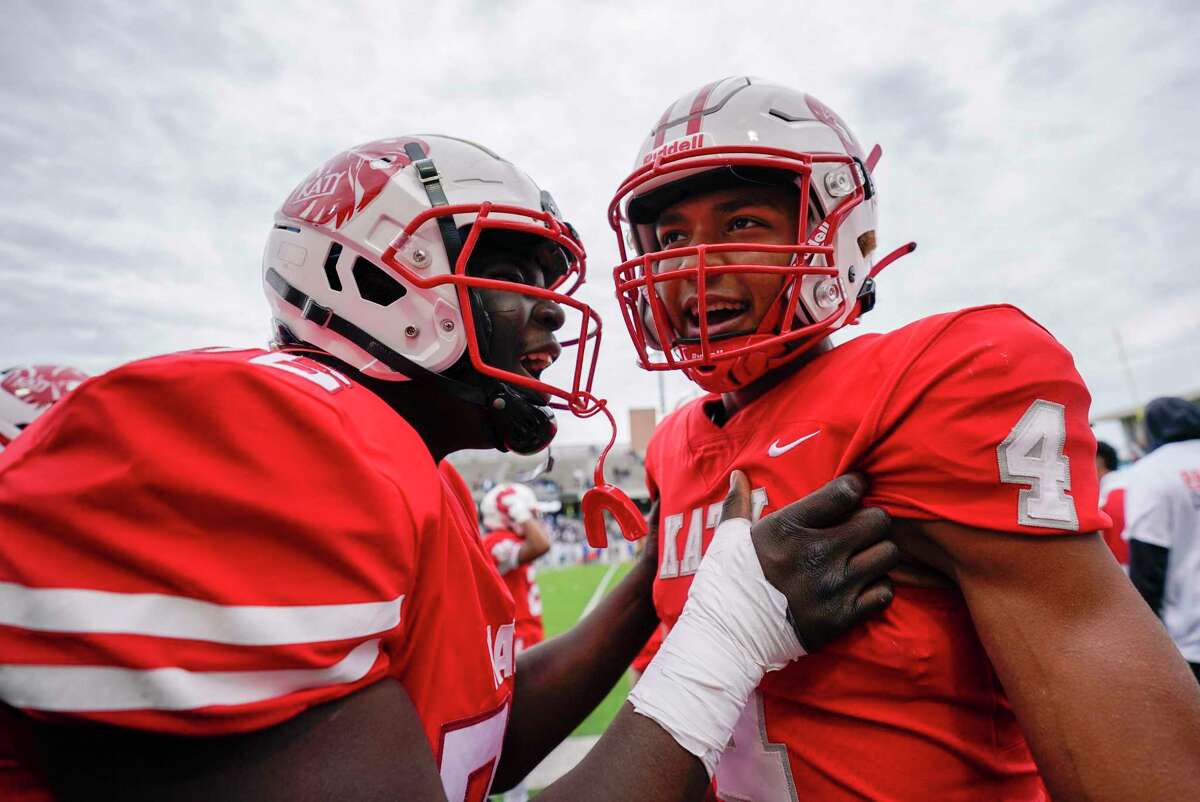Katy wide receiver Nic Anderson (4) celebrates his touchdown with Naason Crowell during the second half of a 6A Division II regional semi-final high school football playoff game against C.E. King, Friday, Nov. 26, 2021, in Katy.