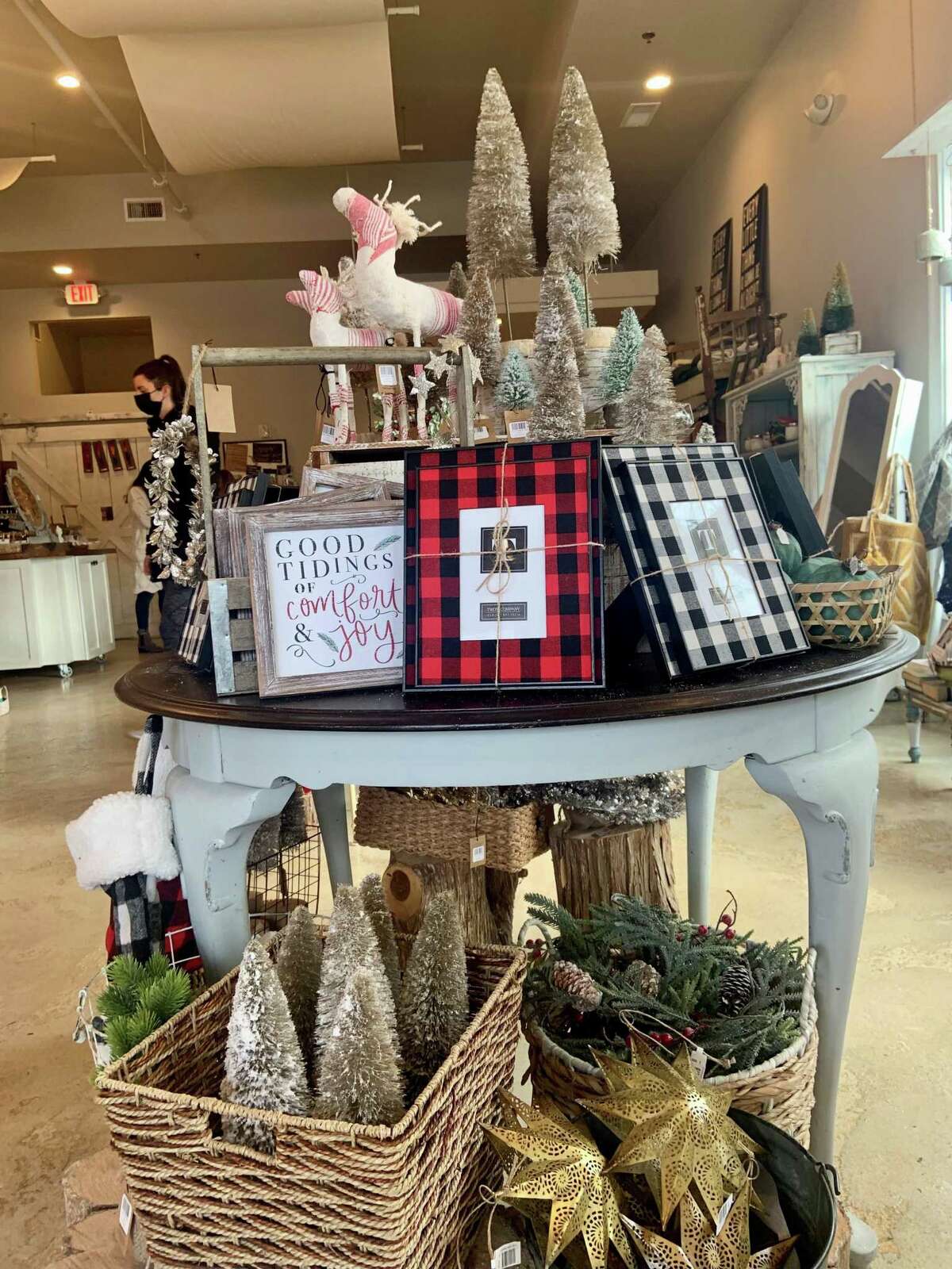 Staff at Pure Poetry, a gift shop on Madison Avenue in Trumbull, finished setting up this Christmas display on Black Friday. Small Business Saturday is a bigger day for the locally owned shop, owner Portia Antonio said.