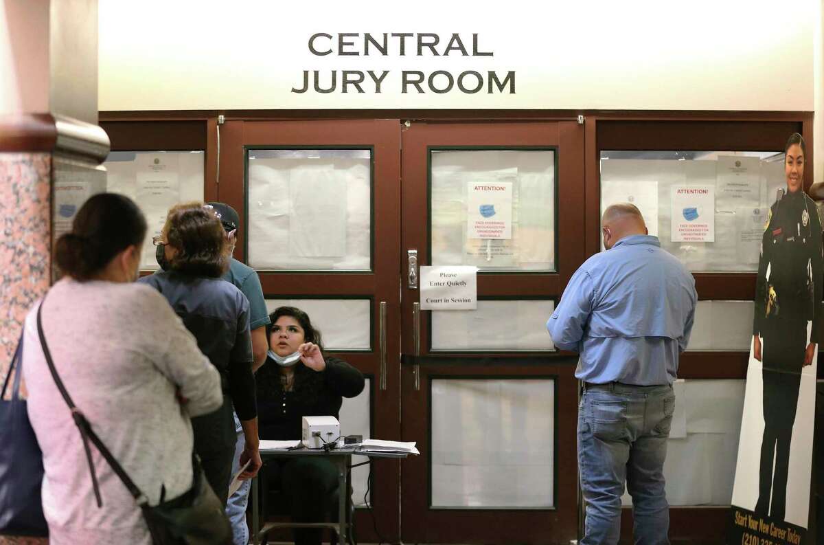 Assistant Juror Bailiff Samantha Zapata checks in potential jurors at the Central Jury Room. As the COVID-19 numbers have decreased in Bexar County, judges are speeding up the process of choosing juries to get more trials set, and Zoom video conferencing is used to qualify potential jurors for in-person questioning.