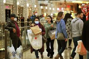 Black Friday shoppers take advantage of steep sale prices at many stores at the Connecticut Post Mall in Milford, Conn., on Nov. 26, 2021.