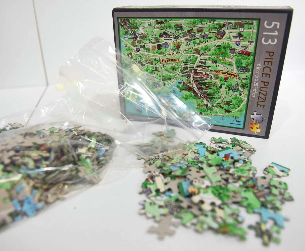 An Old Greenwich-Riverside puzzle is for sale at Smart Kids toy store in Greenwich, Conn. Sunday, Nov. 21, 2021. Smart Kids has a 513-piece puzzle that is a map of the Old Greenwich-Riverside section of town. On Dec. 1, a downtown Greenwich puzzle will arrive just in time for the holidays.
