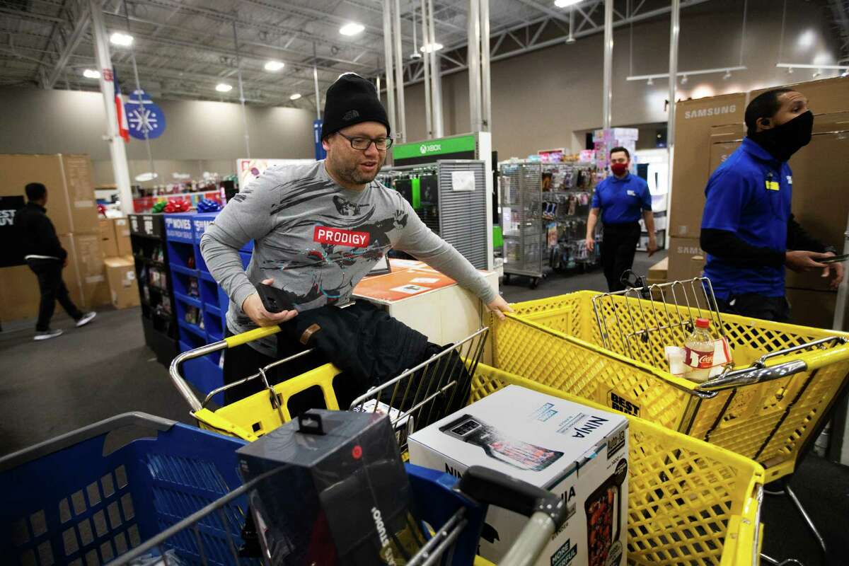 Alfredo Pernia says he knows he can shop the same deals online, but he still arrived at Best Buy on Richmond before its 5 a.m. opening.