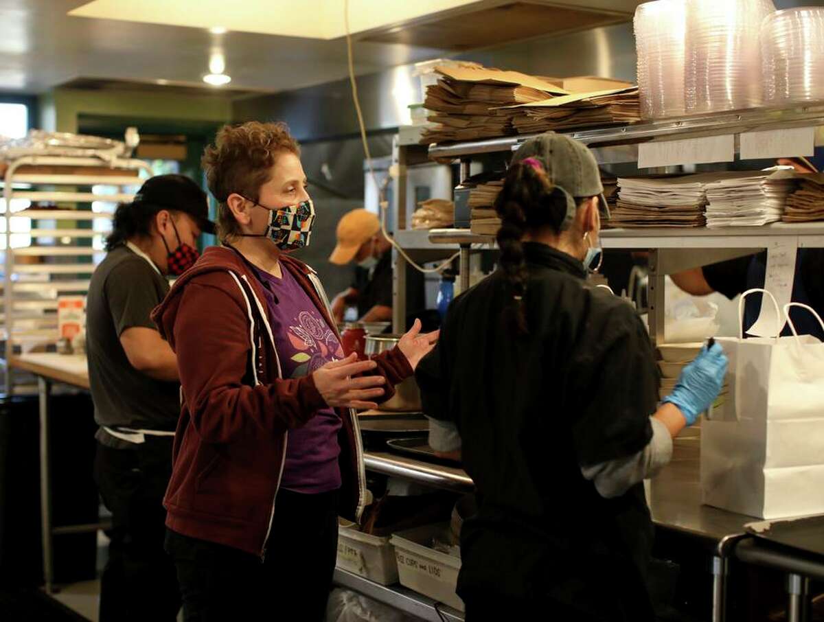 Mica Talmor, owner of Pomella, works in the kitchen at the popular Israeli restaurant in Oakland.