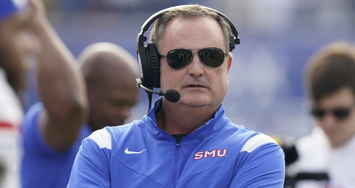 SMU head coach Sonny Dykes watches from the sideline in the first half of an NCAA college football game against Memphis Saturday, Nov. 6, 2021, in Memphis, Tenn. (AP Photo/Mark Humphrey)