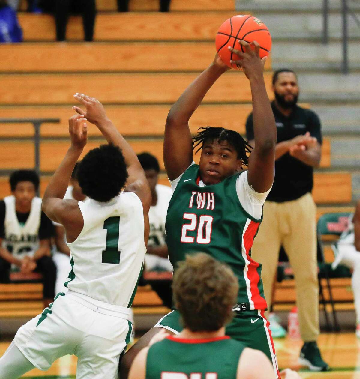 The Woodlands’ David Ifeanyi (20) rebounds during a game at the Rebounders Club Classic at The Woodlands High School, Friday, Nov. 26, 2021, in The Woodlands.