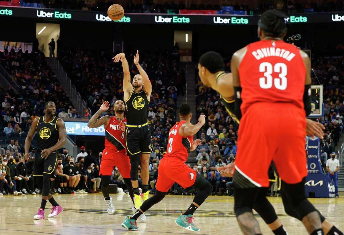 Golden State Warriors guard Stephen Curry shoots a three pointer during the second quarter of his NBA basketball game against Portland Trail Blazers in San Francisco, Calif. Friday, Nov. 26, 2021.