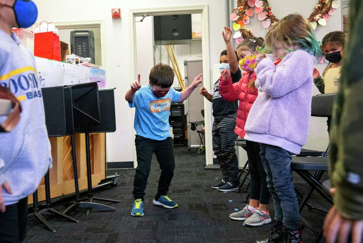First-grader Jackson Ciraulo dances with his classmates in music teacher Carol Prater’s classroom at Roosevelt Elementary in Burlingame.