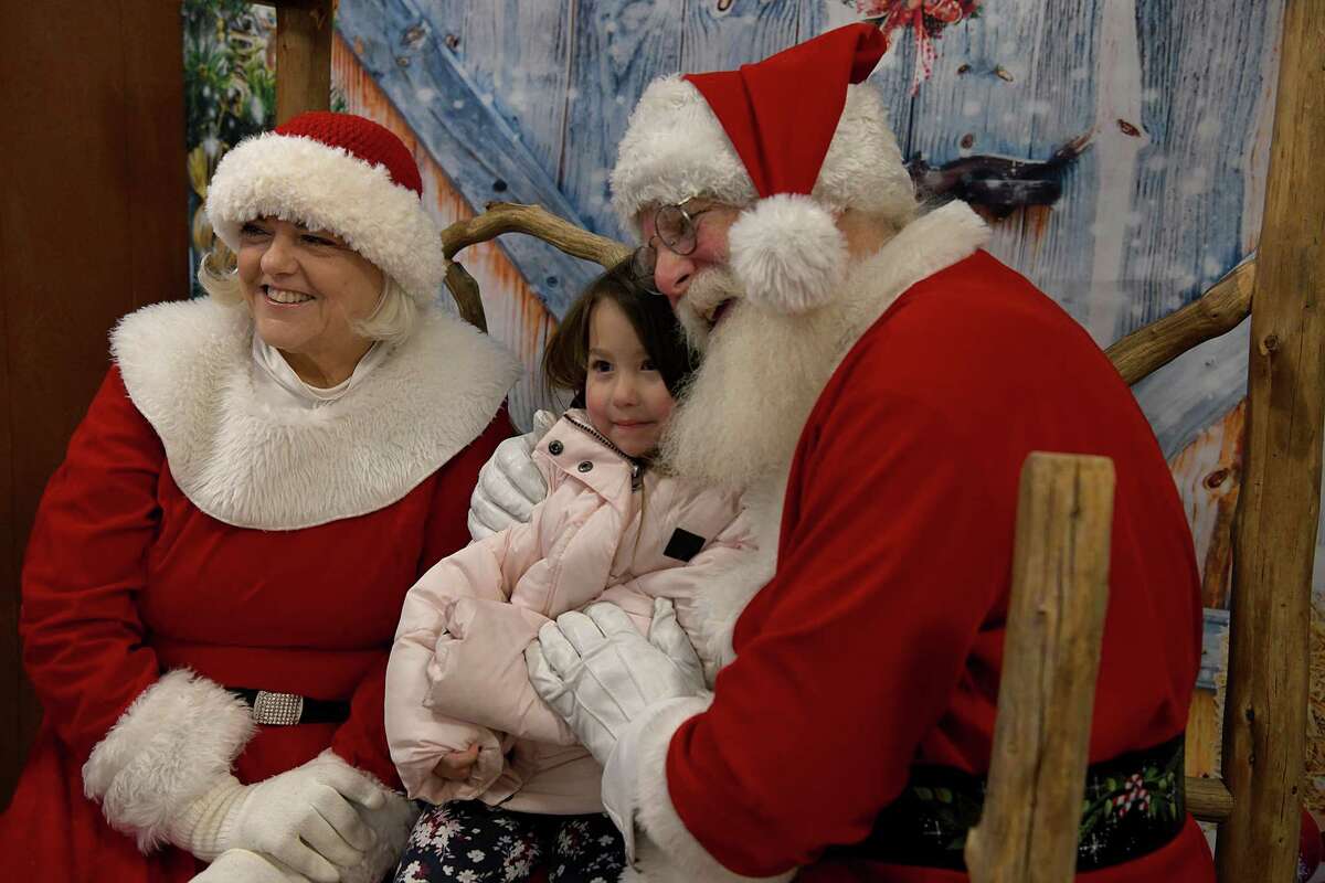 Sicily Sciarrino, 4, of Ridgefield, visits with Santa and Mrs. Claus during Ridgefield’s annual tree lighting on Nov. 26.