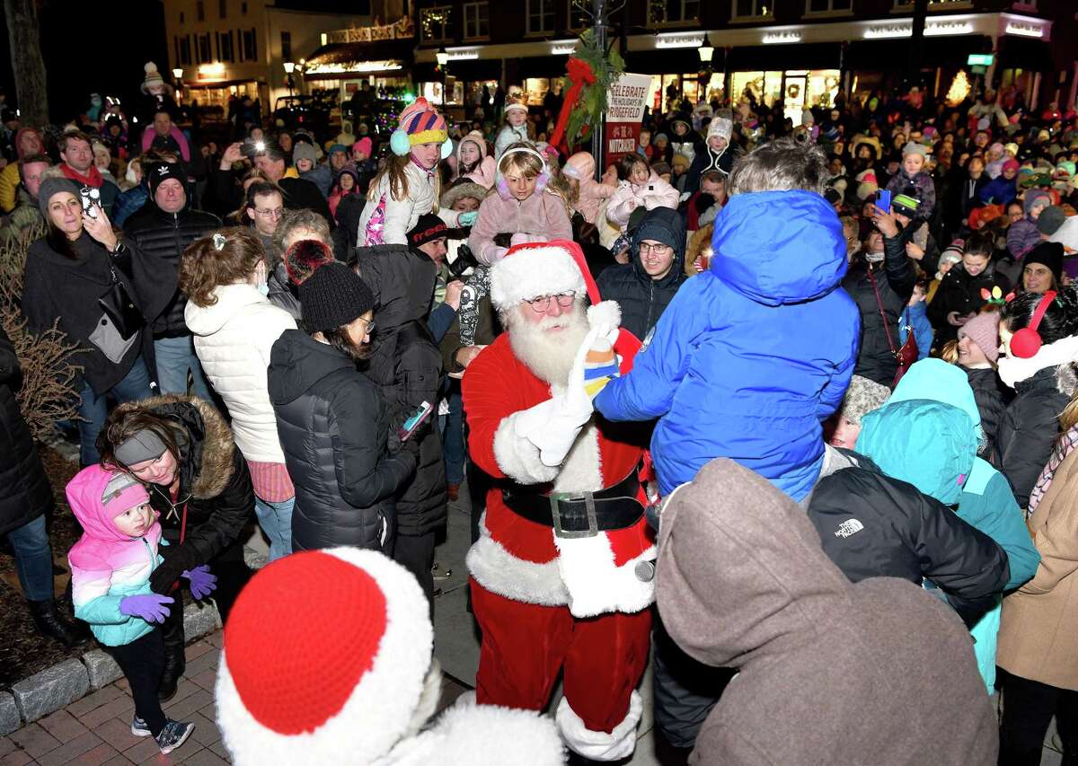 Santa makes his way through the crowd as Ridgefield welcomes the holiday season during its annual tree lighting event on Nov. 26.