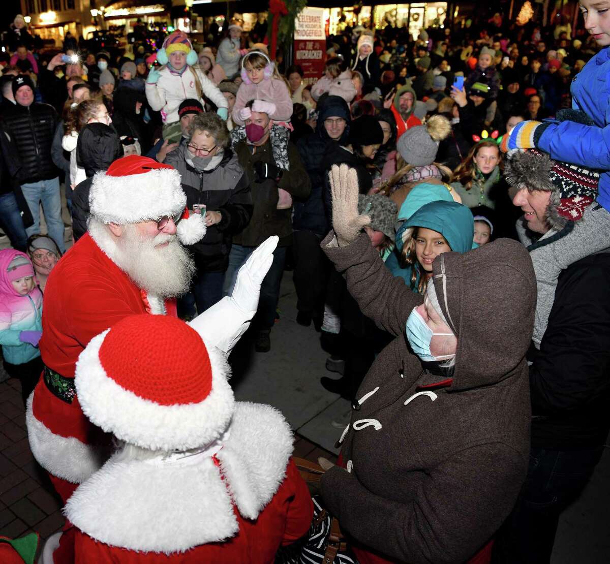 Santa and Mrs. Claus make their way through the crowd as Ridgefield welcomes the holiday season during its annual tree lighting on Nov. 26.