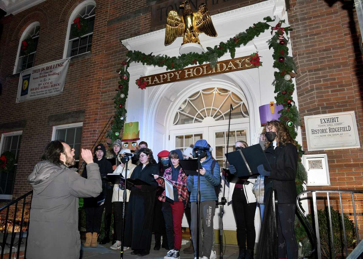The Ridgefield High School Madrigals sing holiday songs on the steps of Town Hall. Ridgefield welcomed the holiday season on Nov. 26 with 17,000 lights, songs and a visit from Santa and Mrs. Claus.