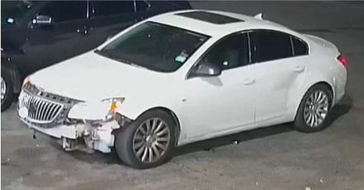 Police are seeking a four-door suspect vehicle that’s white and missing a front bumper.