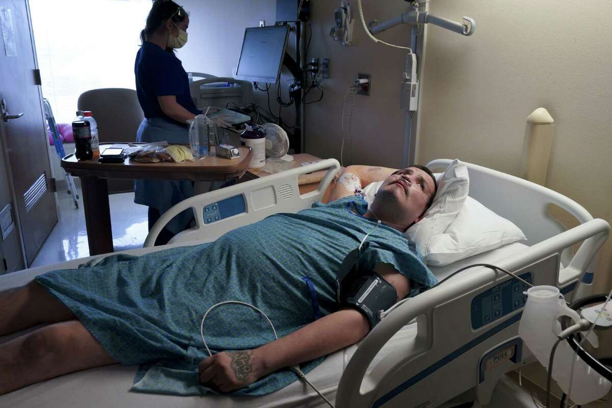 Nathan Foote monitors his vitals while recuperating from a double lung transplant at M Health Fairview University of Minnesota Medical Center on in Minneapolis on April 27, 2021