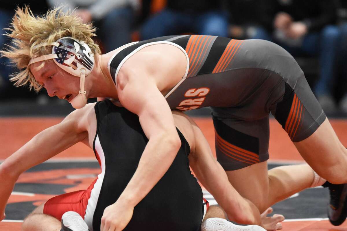 Edwardsville's Dylan Gvillo attempts to take his Springfield opponent to the mat during Saturday's match inside the Jon Davis Wrestling Center.