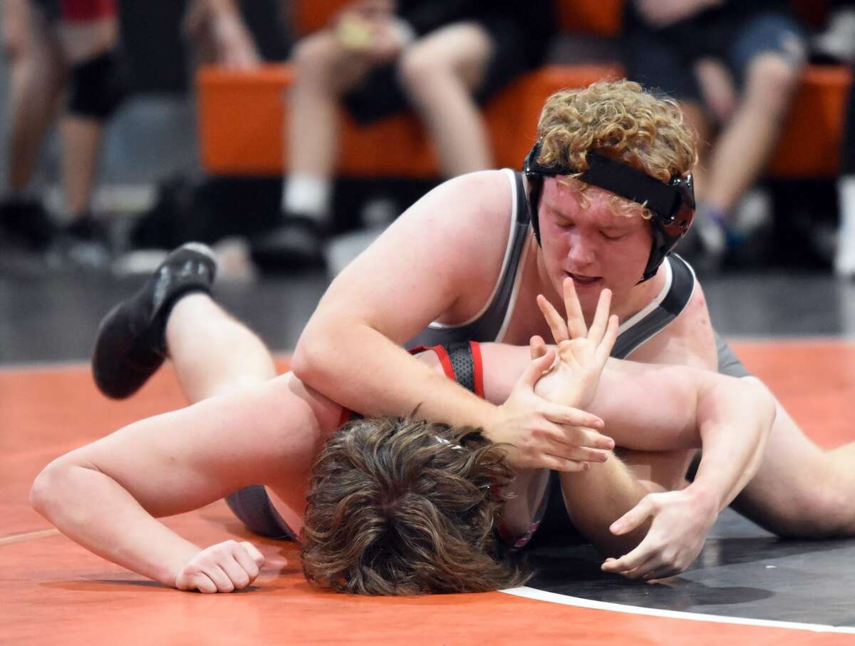 Edwardsville's Cliff Seaman, top, keeps position on his Springfield opponent during his 220-pound match on Saturday inside the Jon Davis Wrestling Center.