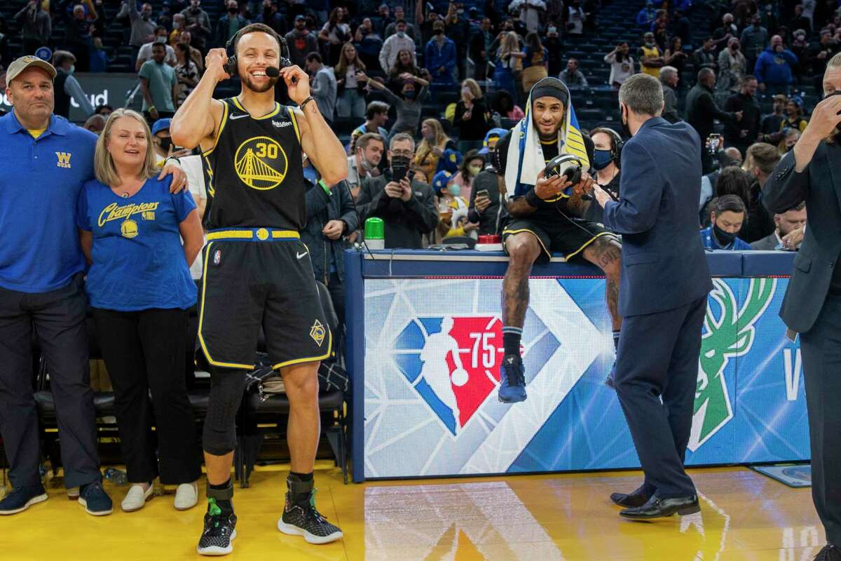 Golden State Warriors guard Stephen Curry (30) and Warriors guard Gary Payton II (0) are interviewed following the NBA game against the New Orleans Pelicans at Chase Center, Friday, Nov. 5, 2021, in San Francisco, Calif.