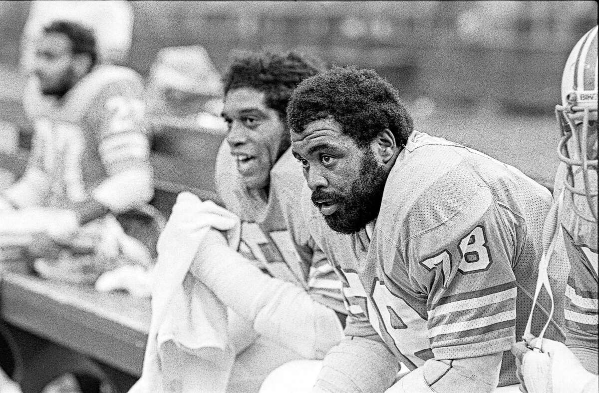 Houston Oilers Elvin Bethea (65) and Curley Culp (78) take a breather on the bench in the Astrodome.