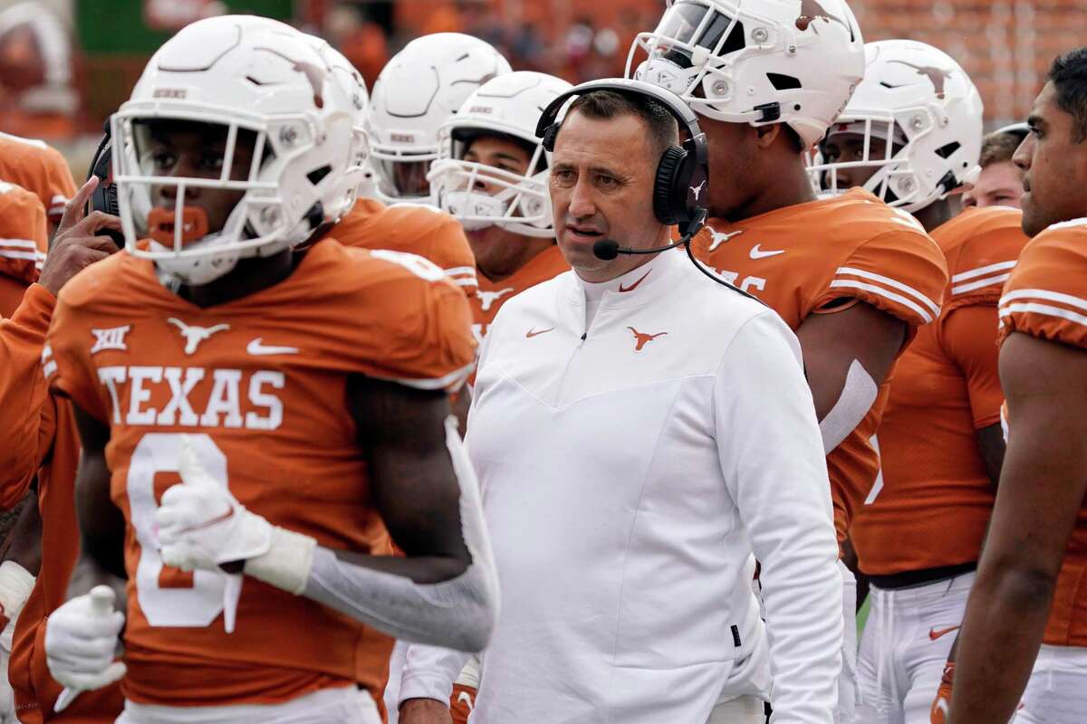Texas head coach Steve Sarkisian calls a play from the sidelines during the first half of an NCAA college football game against Kansas State.