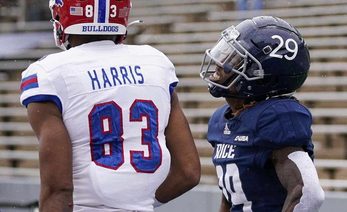 Rice cornerback Sean Fresch (29) taunts Louisiana Tech wide receiver Tre Harris (83) after breaking up a pass intended for Harris in the end zone during the first half of a NCAA college football game, Saturday, Nov. 27, 2021, in Houston.