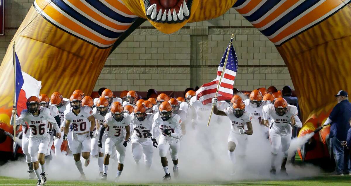 Bridgeland players take the field before the start of their Class 6A Division II area high school football playoff game against College Park Friday, Nov. 19, 2021 at Woodforest Bank Stadium in Shenandoah, TX.