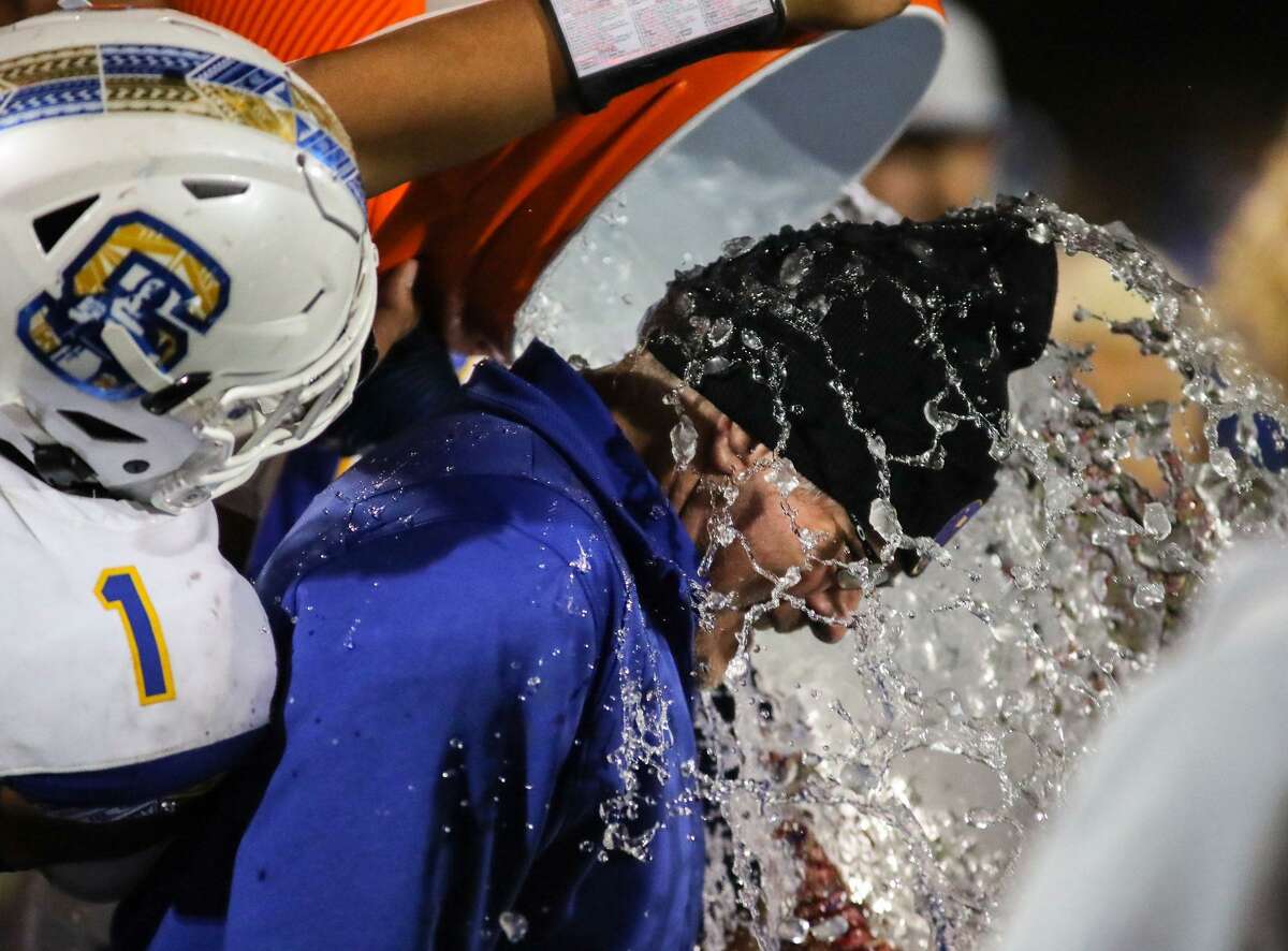 Serra coach Patrick Walsh gets drenched after his team's 16-12 Central Coast Section Division I championship game win over St. Francis at Westmont High in Campbell on Friday, Nov. 26, 2021.