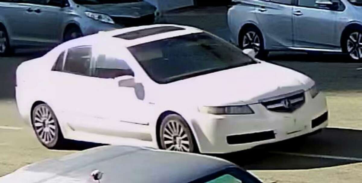 The Oakland Police Department released a surveillance photo of a vehicle it believes was used in the attempted robbery and fatal shooting of a news crew guard: a four-door white 2004 to 2008 Acura TL, with sunroof and no front license plate.