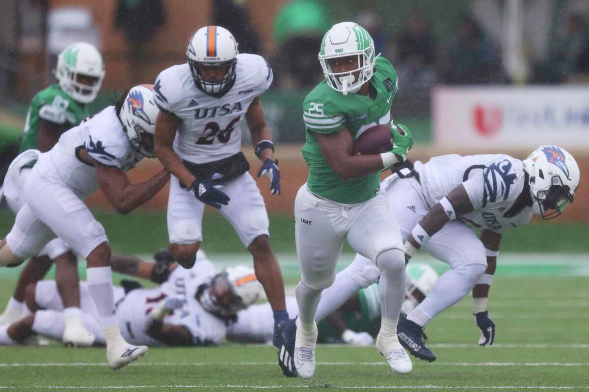 North Texas running back Ikaika Ragsdale rushes the ball during the first half of an NCAA college football game against UTSA in Denton, Texas, Saturday, Nov. 27, 2021. 