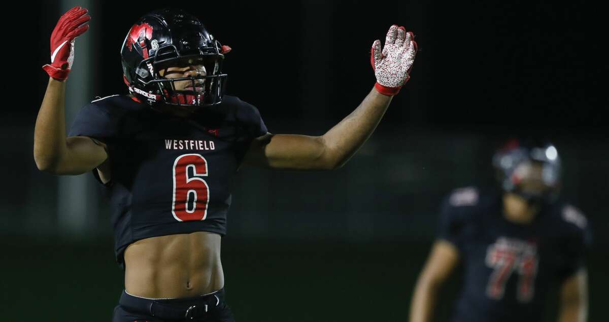 Westfield wide receiver Chuuky Hines (6) reacts as running back Taji Atkins (21) runs for a 79-yard touchdown in the first quarter of a Region II-6A (Div. 1) bi-district high school football game at Planet Ford Stadium, Thursday, Nov. 11, 2021, in Spring.