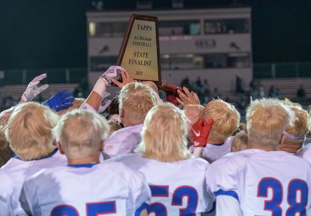 Midland Christian players hold the State Finalist trophy high following the 41-14 win over Central Catholic 11/27/2021 during the TAPPS Division 1 state semifinal at Gordon Wood Stadium in Brownwood, Tx. Tim Fischer/Reporter-Telegram
