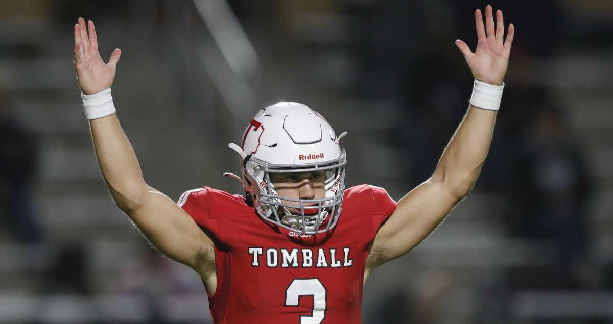 Tomball quarterback Cale Hellums (3) celebrates after a 15-yard touchdown to wide receiver Jayden Grey during the second quarter of a Region II-6A (Div. II) area football game at Planet Ford Stadium, Friday, Nov. 19, 2021, in Spring.