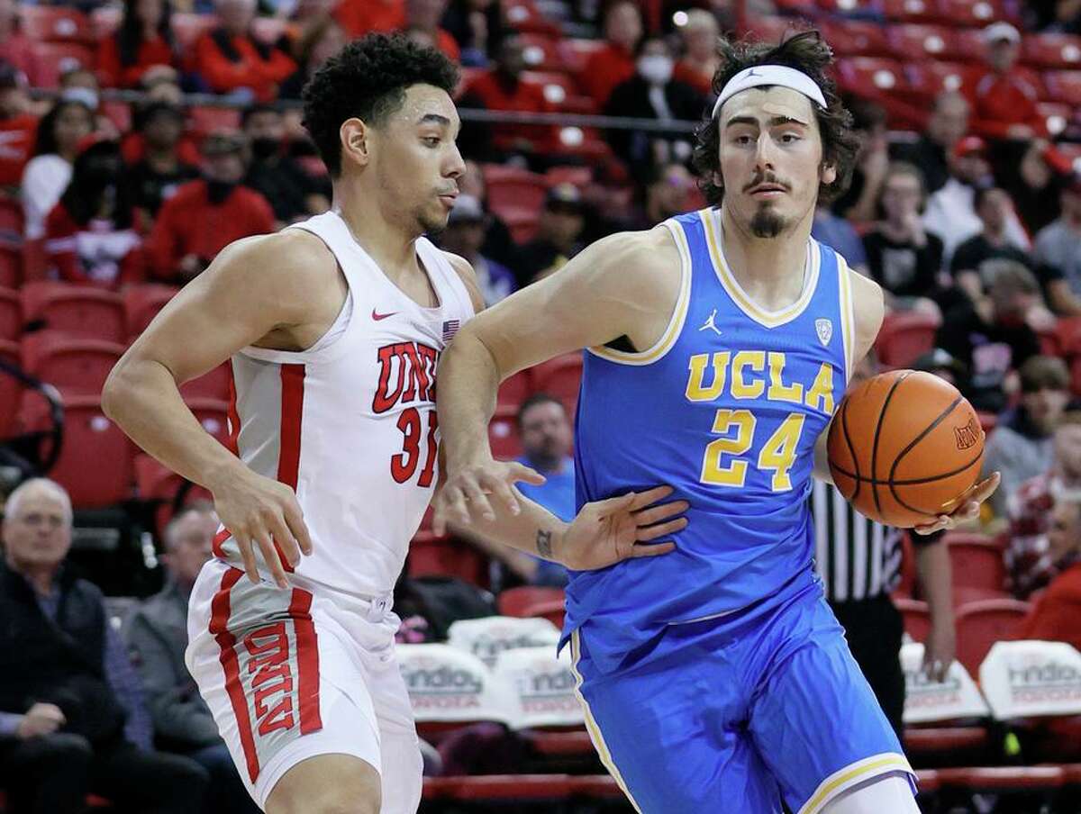 Jaime Jaquez Jr., who had 12 points, drives against UNLV’s Marvin Coleman in No. 2 UCLA’s bounce-back win.