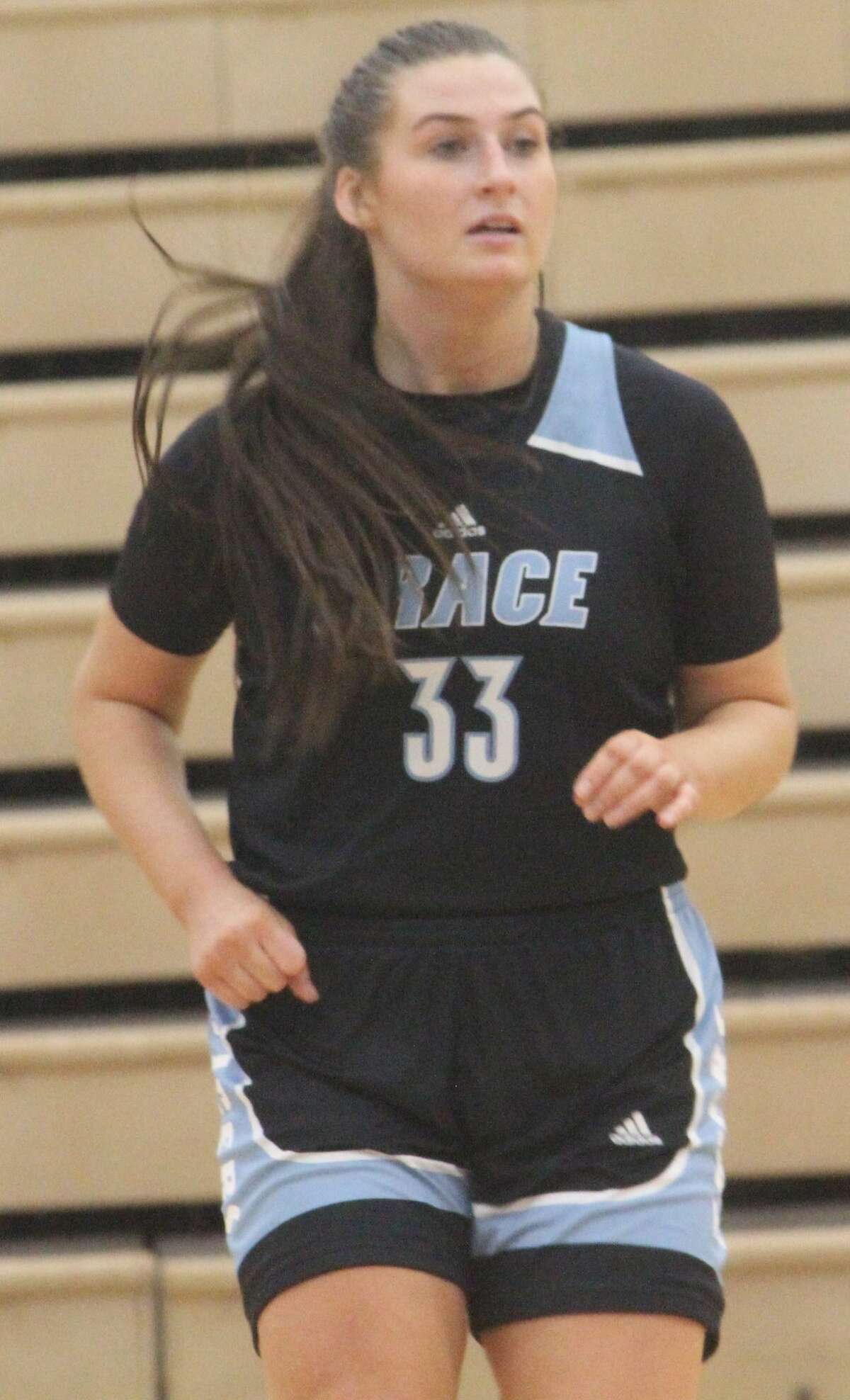 Former Reed City girls basketball standout Emily Libey looks to make a play for Grace Christian against Ferris State on Saturday.
