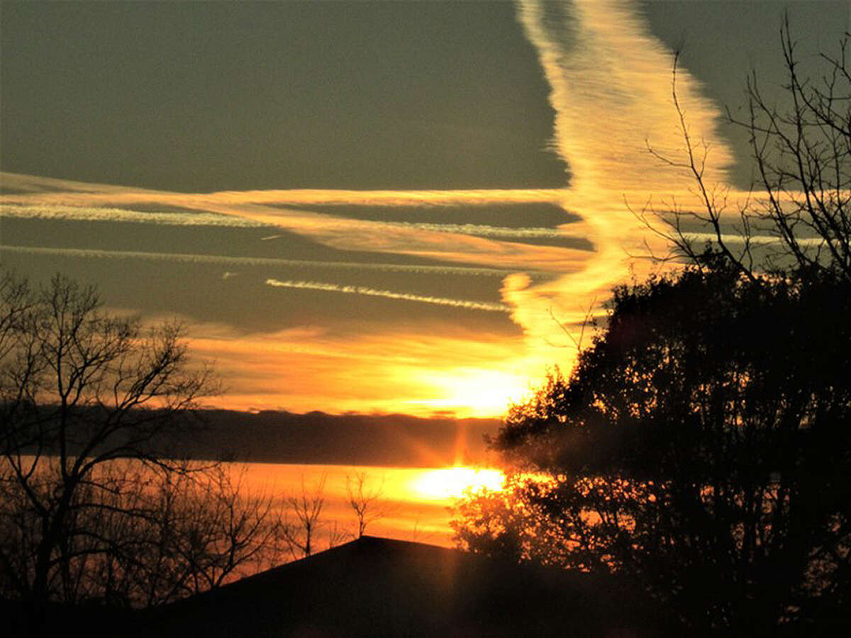A cloud formation near the setting sun creates an angelic appearance.