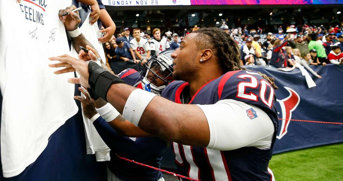 Houston Texans safety Justin Reid (20) and cornerback Terrance Mitchell (39) interact with fans before walking off the field, following the Texans 38-22 loss against the Los Angeles Rams at NRG Stadium on Sunday, Oct. 31, 2021, in Houston.