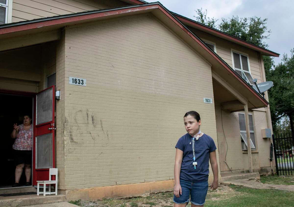 Stephanie Mejia, 11, stands outside her family's home in San Antonio. A student at Tafolla Middle School, she went months without speech therapy or homebound classes because of staff shortages and a paperwork error.