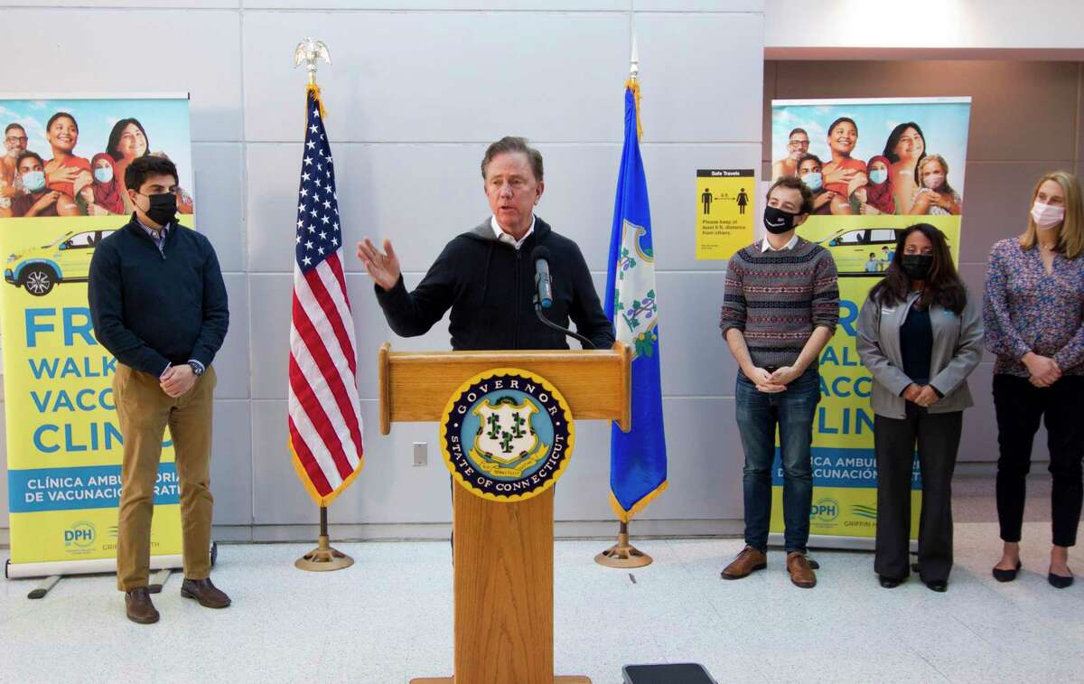 Gov. Ned Lamont holds a press conference at the Stamford Transportation Center to promote the use of the free walk-in vaccination clinic located there in Stamford, Conn., on Wednesday November 24, 2021.