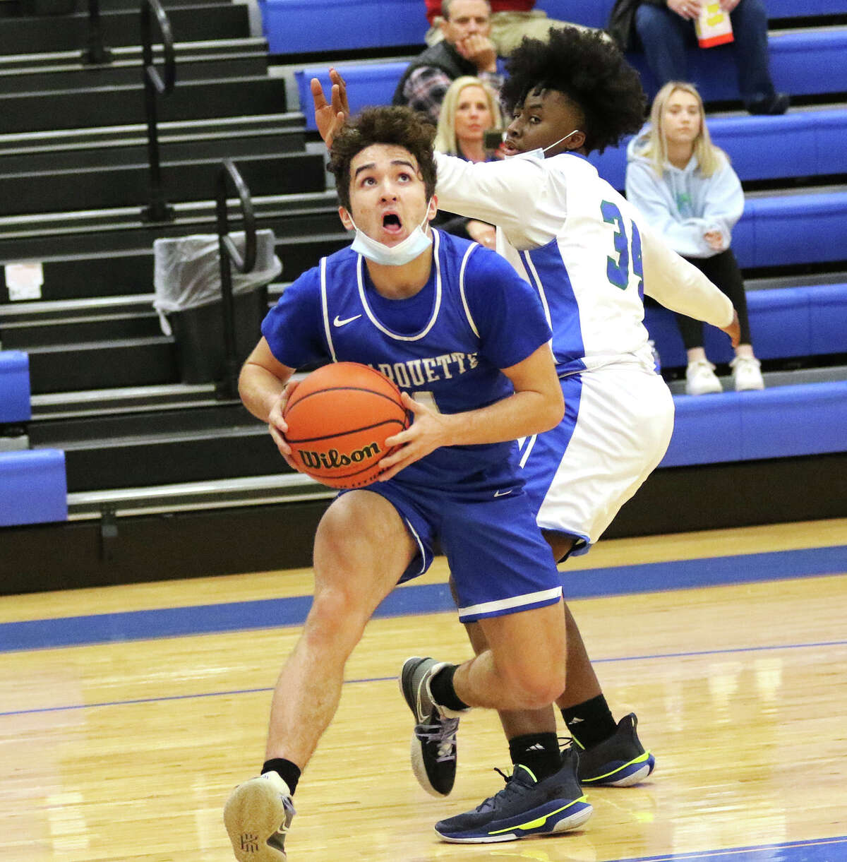 Marquette's Parker Macias (left) scored 17 points Monday to lead the Explorers past Watyerloo in the opening game of pool play at the Columbia-Freeburg Holiday Tournament in Columbia. he is shown in action earlier  this season.
