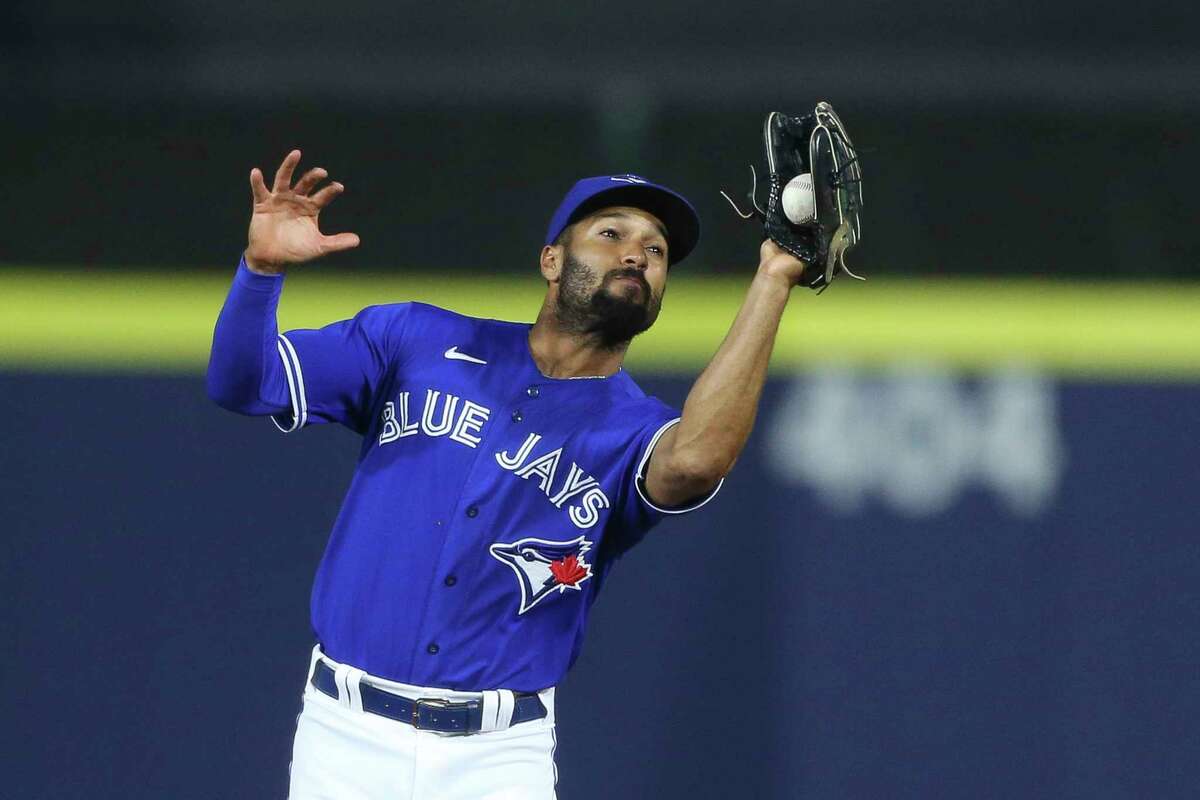 Toronto Blue Jays second baseman Marcus Semien makes a catch to get out Baltimore Orioles' Ryan Mountcastle during the tenth inning of the baseball game in Buffalo, N.Y., Friday, June 25, 2021. (AP Photo/Joshua Bessex)
