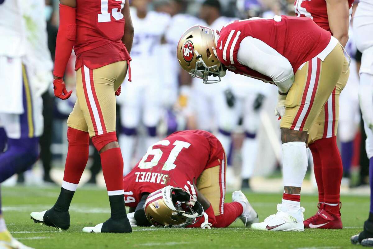 49ers wide receiver Deebo Samuel reacts after sustaining a groin injury in the third quarter of a 34-26 win over the Vikings.