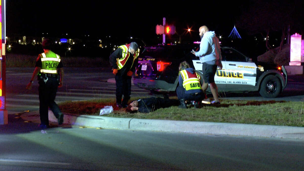 Three people, including a San Antonio police officer, were hospitalized after a man ran a red light in the 100 block of W Military Drive on Nov. 28, 2021, according to officials at the scene. The officer was the third SAPD officer injured in a crash this weekend.