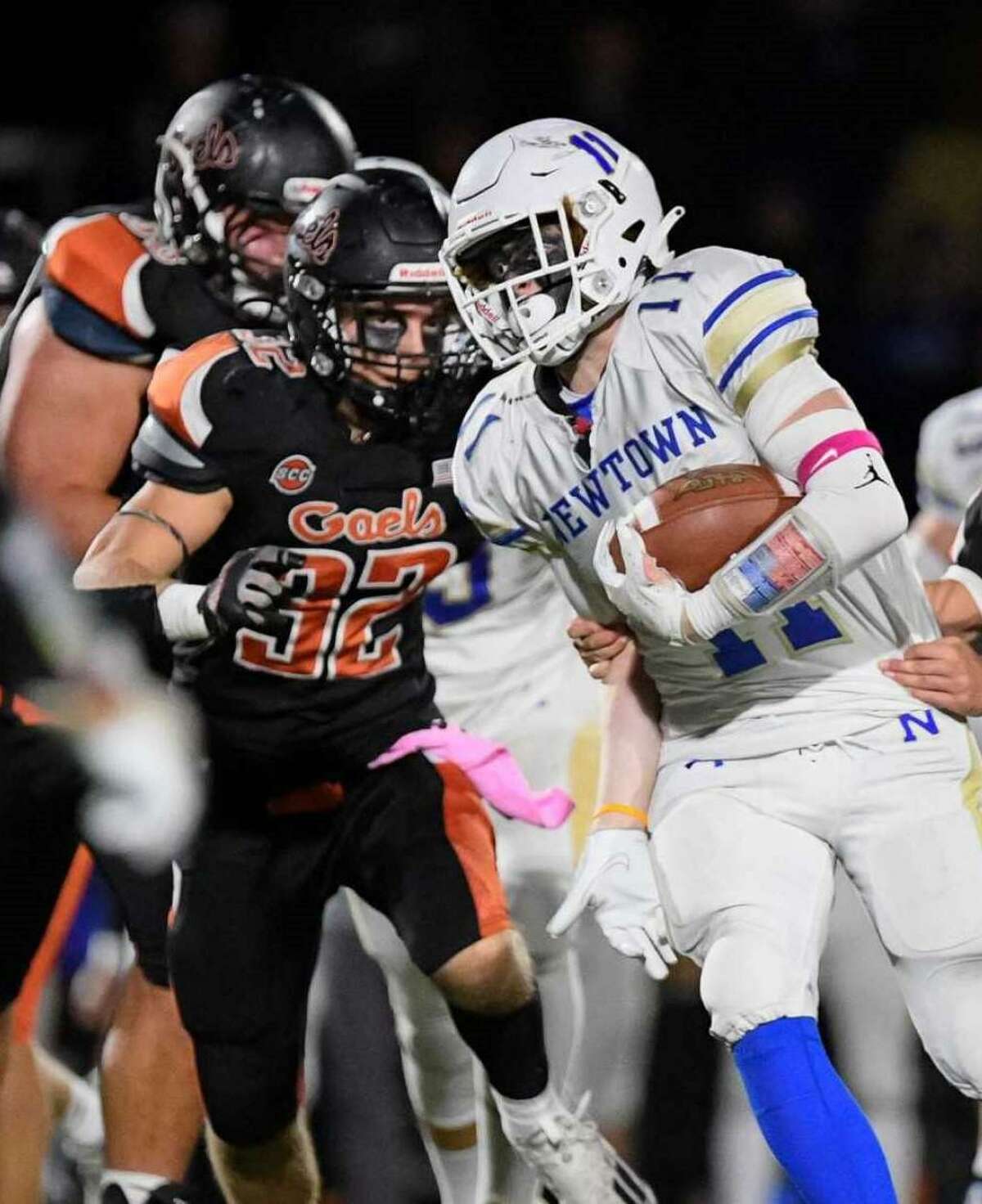 Shelton's All-SCC Tier 1 defender Matt Lockavitch closes in on a Newtown runner.