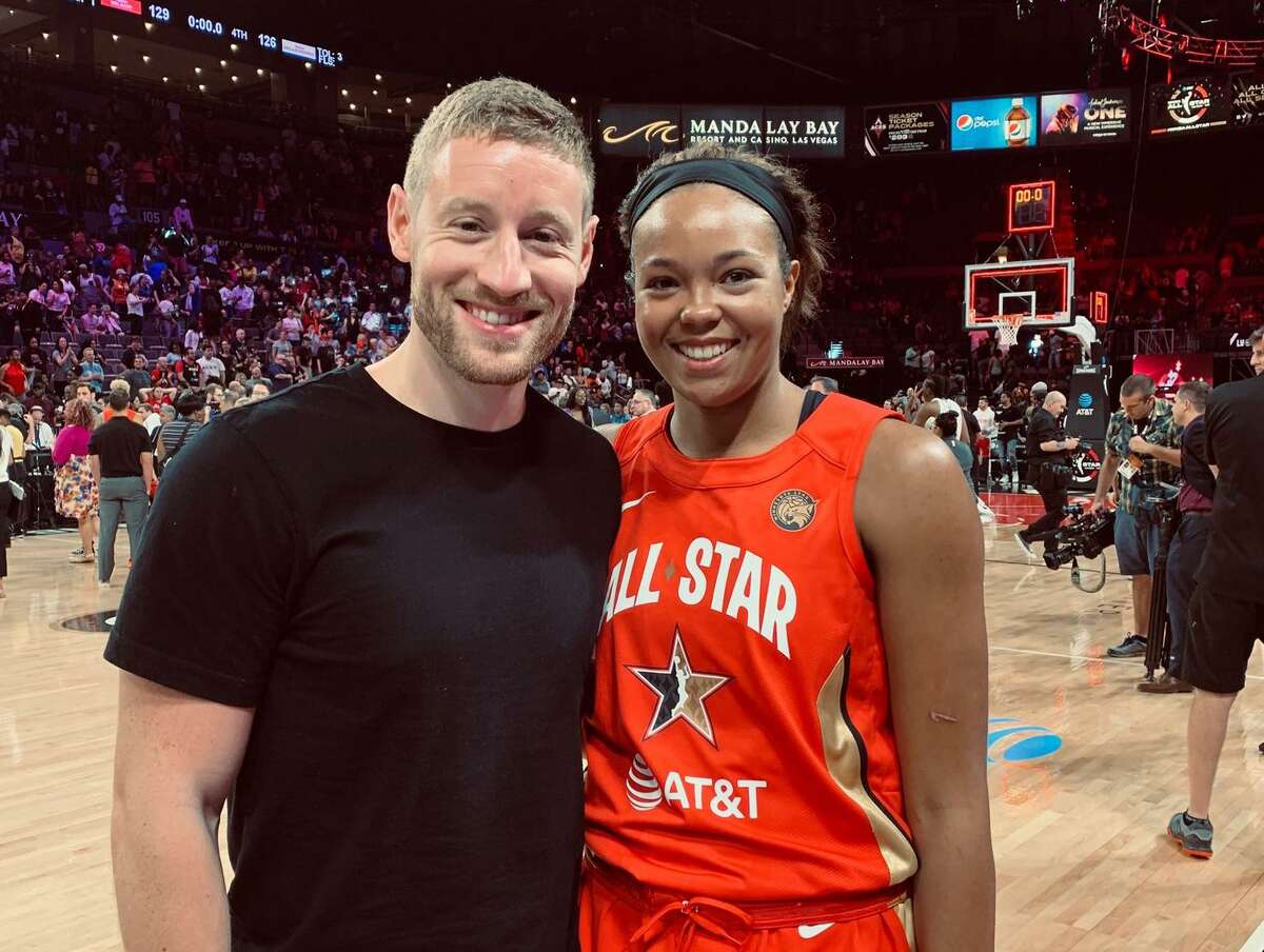 Basketball trainer Arez Bazel (left) and his fiancé Lynx star Nafisa Collier (WNBA All-Star Game).