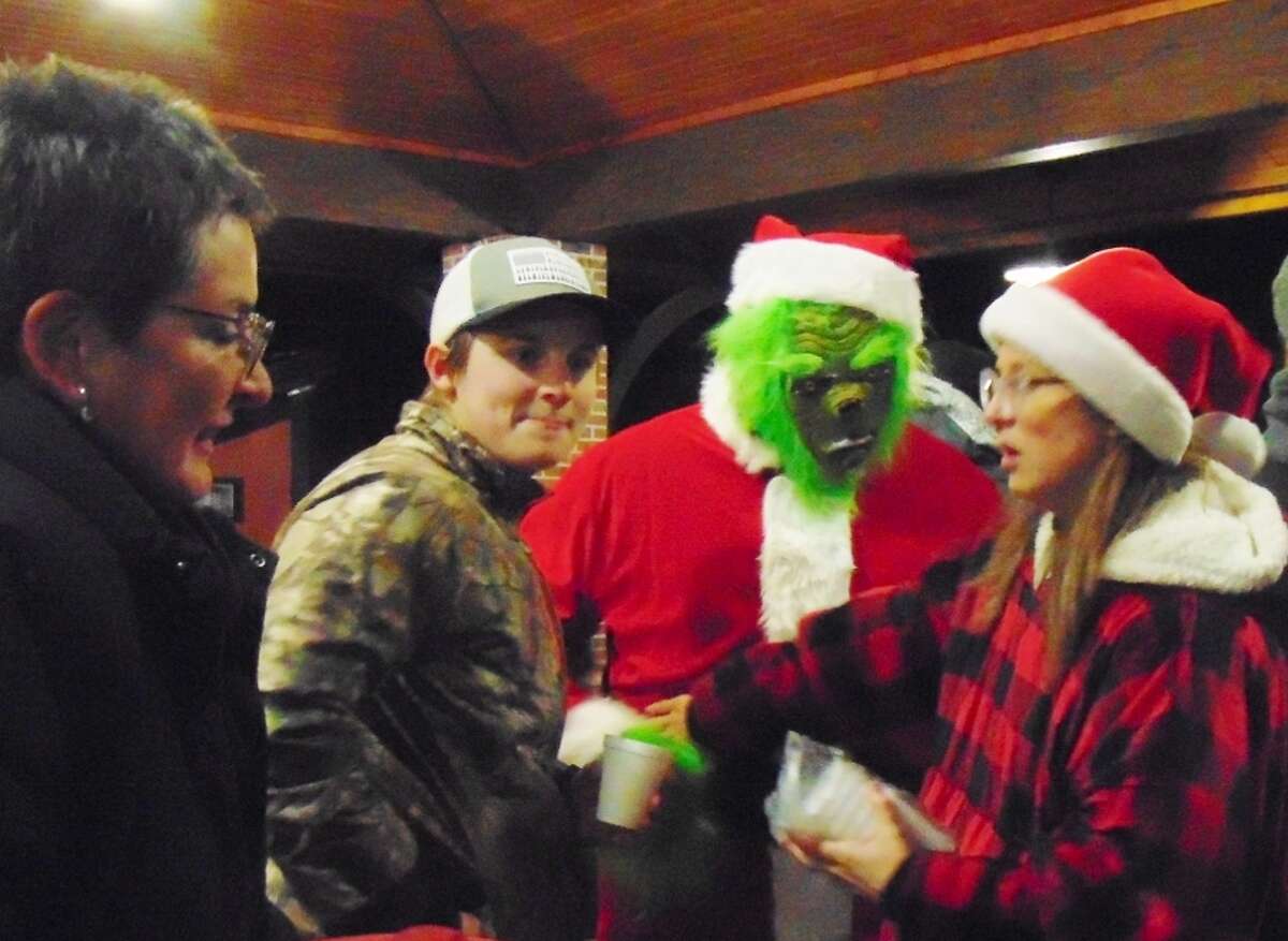 People visited with the Grinch over a cup of hot chocolate.