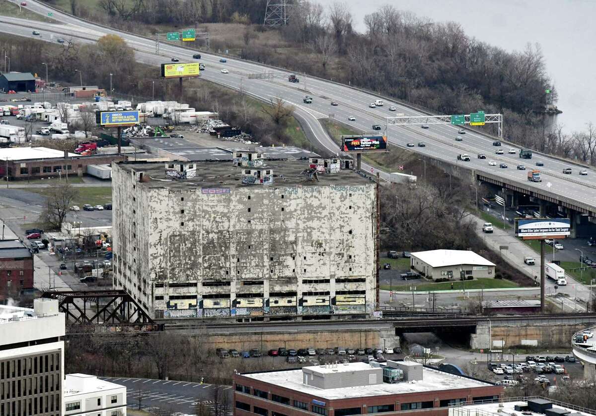 Central Warehouse viewed from Corning Tower on Nov. 29, 2021. Decades of decay culminate last month with a 3-day halt to train travel next to the building as chunks of the facade fell near the tracks. Plenty of redevelopment ideas have been proposed over the decades but little has happened to save a building officials now call dangerous.