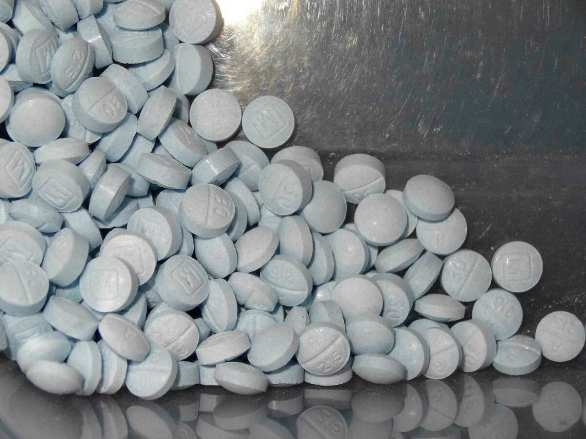This photo provided by the U.S. Attorneys Office for Utah and introduced as evidence at the Aaron Shamo trial shows fentanyl-laced fake oxycodone pills collected during the investigation. Shamo called himself a “white-collar drug dealer,” drew in co-workers from his time at eBay and peppered his messages to them with smiley-face emojis. (U.S. Attorneys Office for Utah via AP)